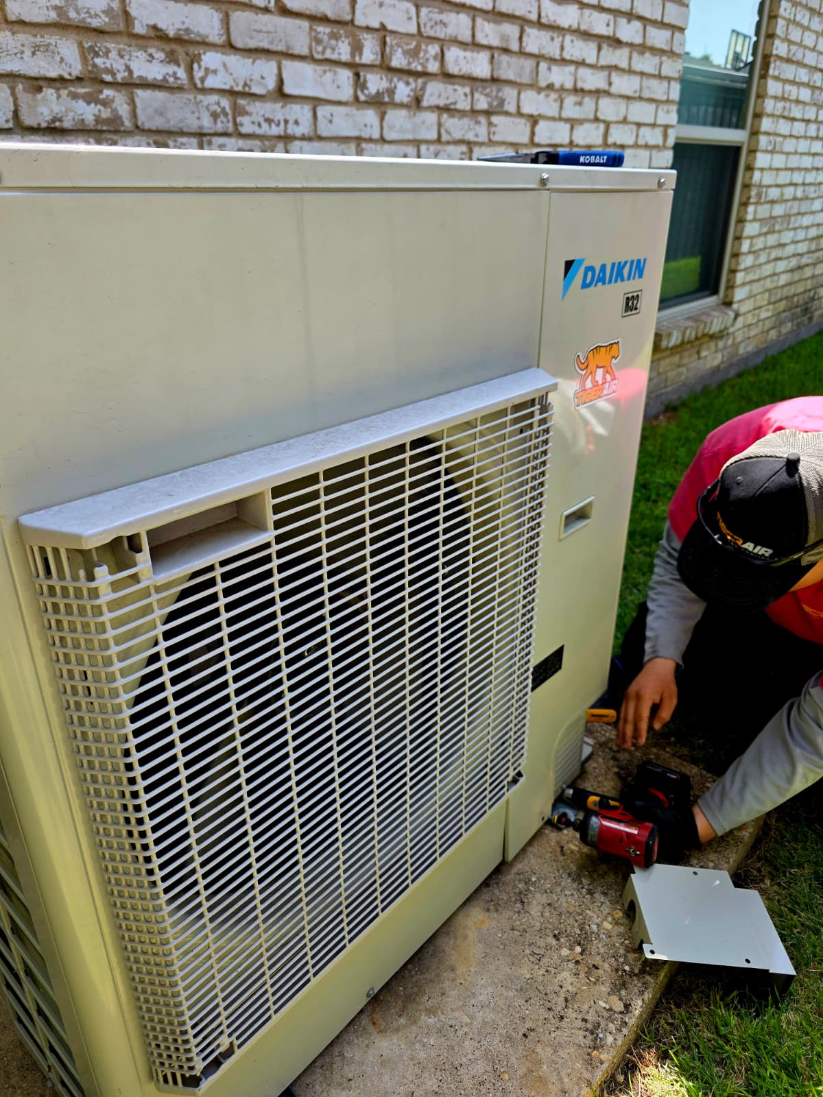 Tiger Air Team Member installing a Daikin HVAC system